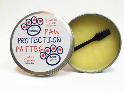 All natural paw protection balm for pets, made in Canada. Open 80 g tin with applicator.