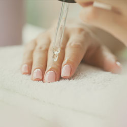 Oil application on nails.