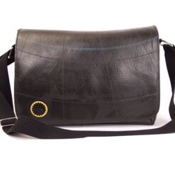 Handbag made of recycled tire inner tube. Cotton lining and adjustable strap. Front flap, zippered top.